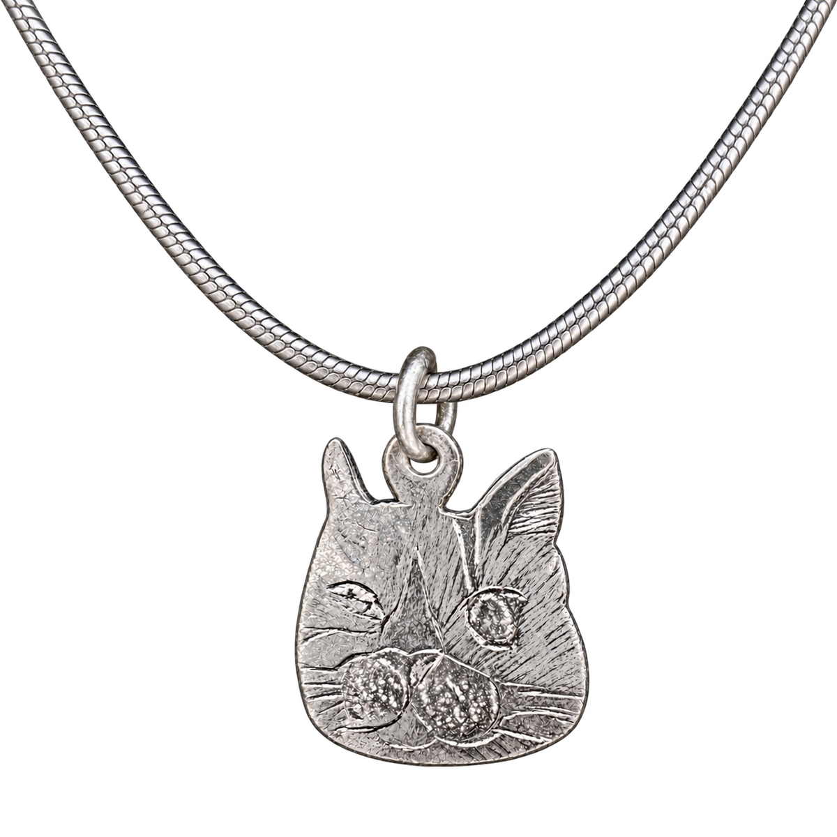 Handmade silver cat face pendant necklace with neutral silver colour and balanced product framing